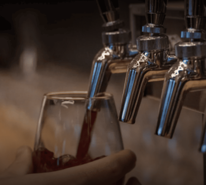 A draught beer being poured.