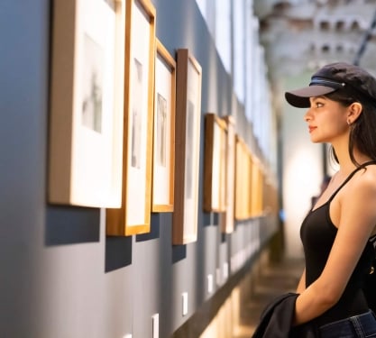 A woman looking at art on a gallery wall in the Museum of Contemporary Art in Denver, Colorado.