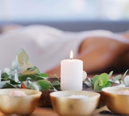 A woman enjoying a massage at The Oxford Club & Spa in Denver, Colorado