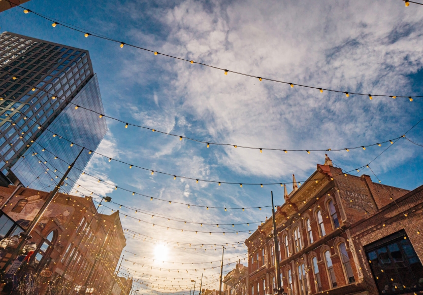 Decorative bulb lights strung above the street at Larimer Square in Denver, Colorado.