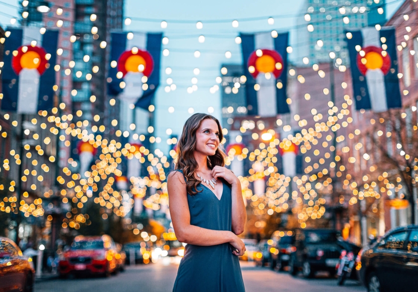 A woman in front of a light display at Larimer Square in Denver, Colorado.