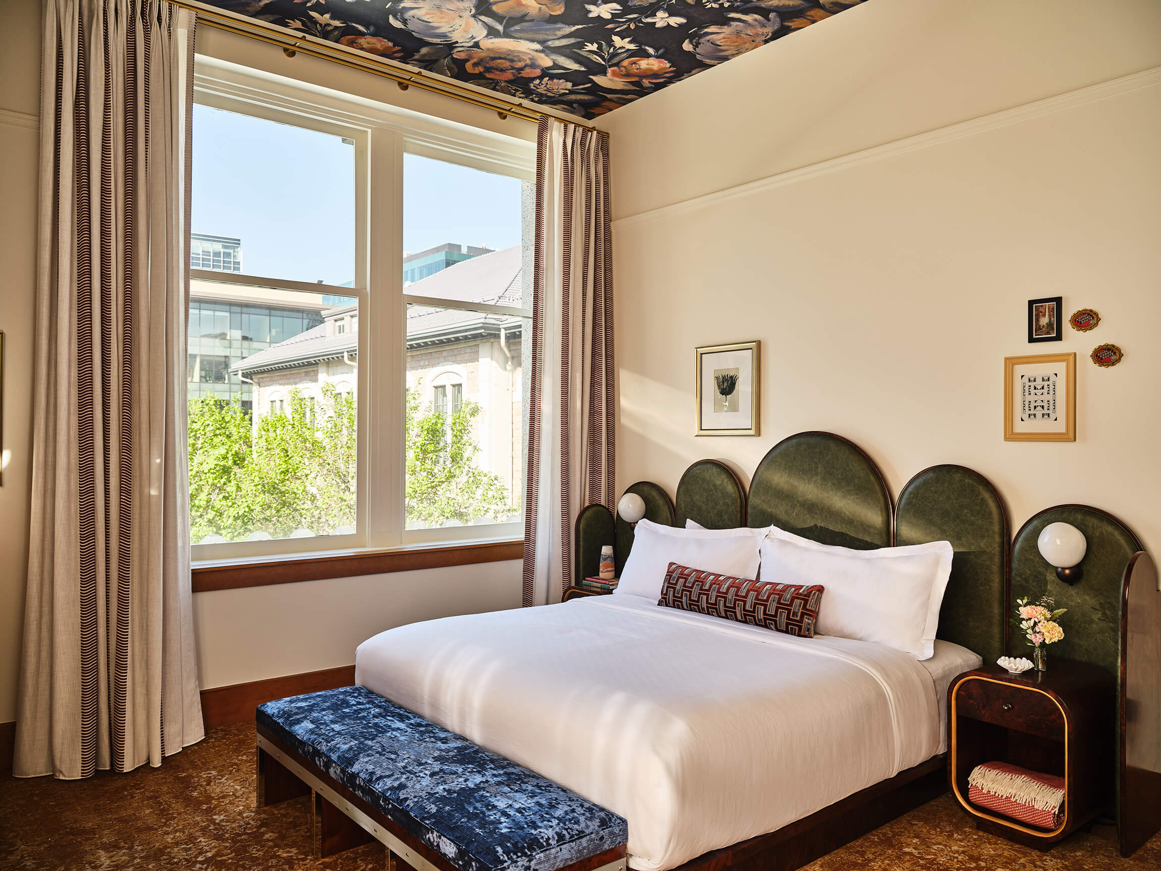 A king bed in the Deluxe Classic Guest Room at the Crawford Hotel in Denver, Colorado.