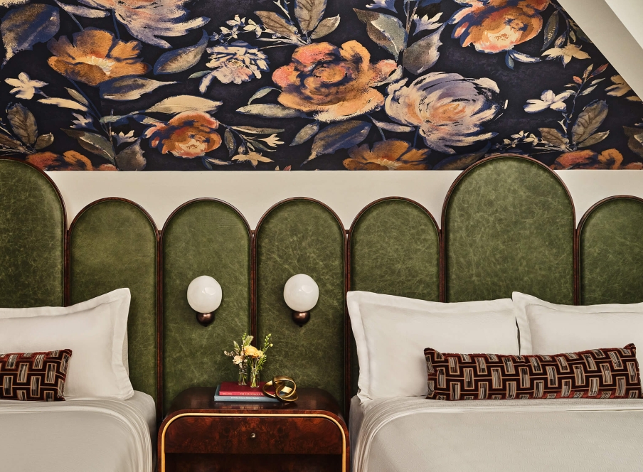 Two queen beds in the Deluxe Loft Guest Room at the Crawford Hotel in Denver, Colorado.