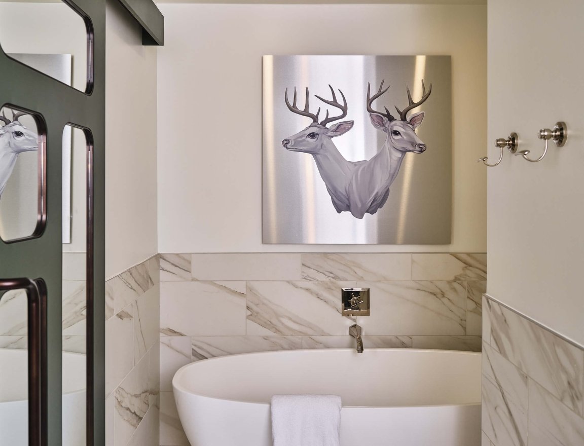 Bathtub of the bathroom in the Premium Loft Guest Room at the Crawford Hotel in Denver, Colorado.