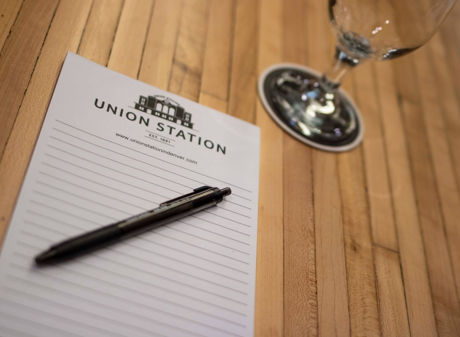 Union Station branded stationary on a boardroom table in the Belz Boardroom at the Crawford Hotel in Denver, Colorado.
