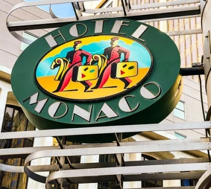 The green sign to Hotel Monaco in Denver, Colorado.
