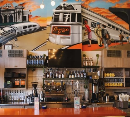 The mural above the bar at Snooze Eatery at Union Station in Denver, Colorado.