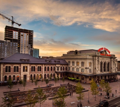 The exterior of Union Station, sunset in the background at the Crawford Hotel in Denver, Colorado.